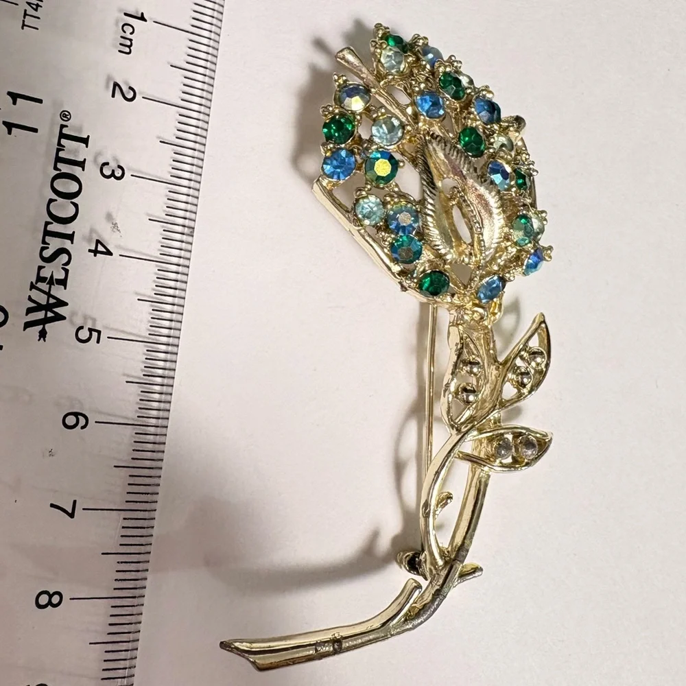 Elegant Gold tone and Blue enabled vintage aurora borealis Brooch